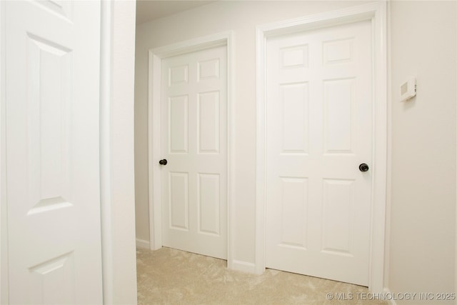 416434 Lakeside, Checotah, OK 74426 - hallway featuring light colored carpet and baseboards