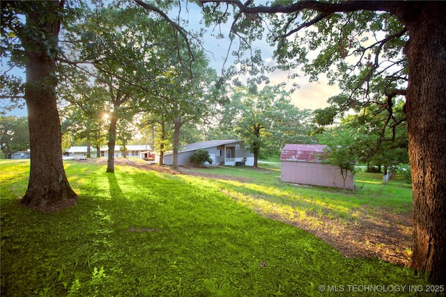 416434 Lakeside, Checotah, OK 74426 - view of grassy yard featuring a storage shed