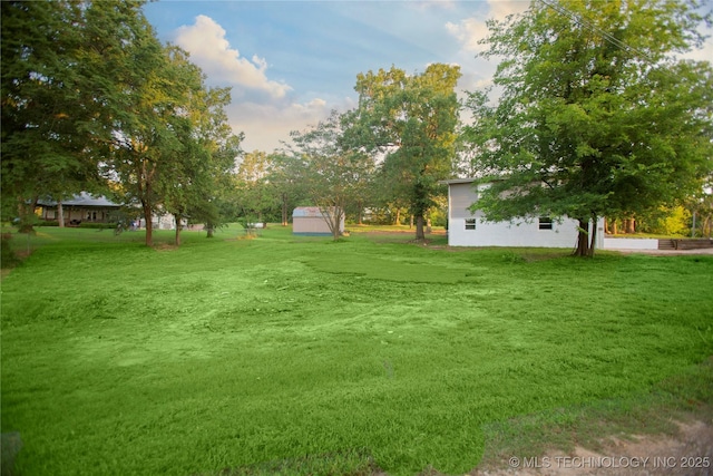 416434 Lakeside, Checotah, OK 74426 - view of grassy yard featuring a storage unit