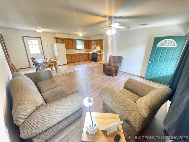 17564 W Grandview Dr, Tahlequah, OK 74464 - living room featuring ceiling fan and light wood-style flooring