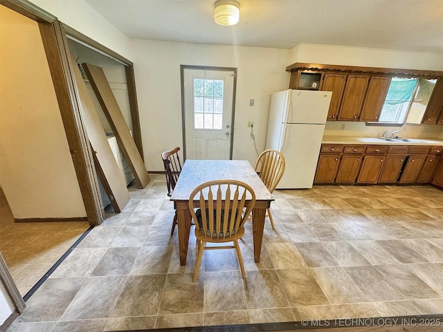 17564 W Grandview Dr, Tahlequah, OK 74464 - dining space featuring healthy amount of natural light and stone finish floors