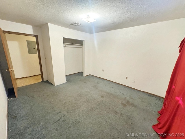 17564 W Grandview Dr, Tahlequah, OK 74464 - unfurnished bedroom featuring electric panel, carpet, a textured ceiling, and a closet