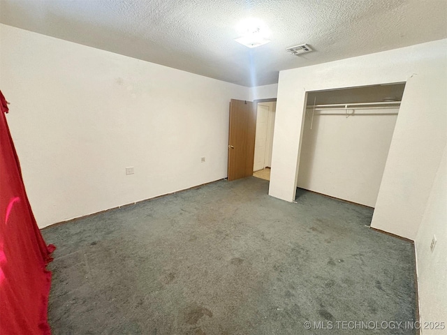 17564 W Grandview Dr, Tahlequah, OK 74464 - unfurnished bedroom featuring carpet floors, a closet, and a textured ceiling