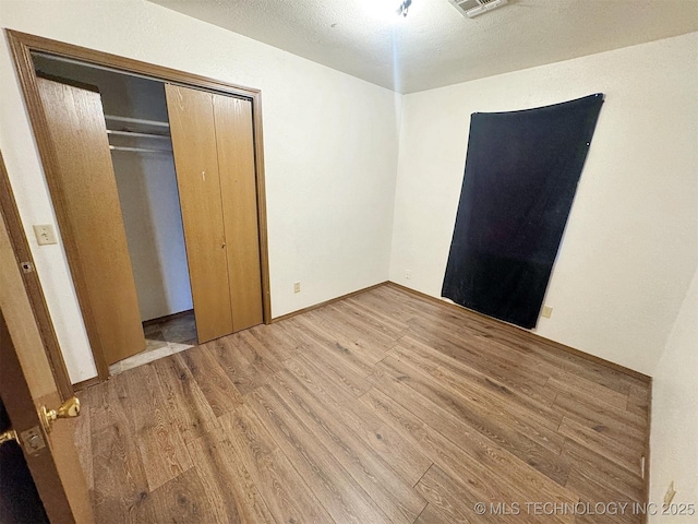 17564 W Grandview Dr, Tahlequah, OK 74464 - unfurnished bedroom with wood finished floors and a closet