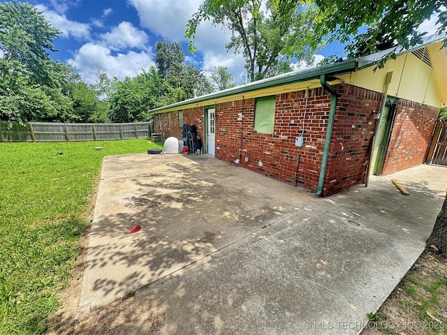 17564 W Grandview Dr, Tahlequah, OK 74464 - view of side of home featuring brick siding and a patio area