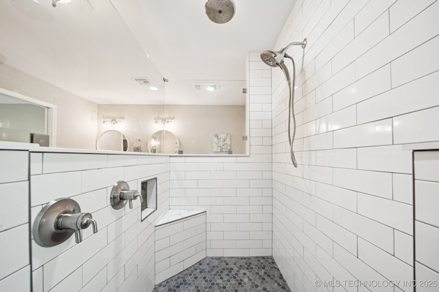 7705 S 232nd E Ave, Broken Arrow, OK 74014 - full bathroom featuring a tile shower, recessed lighting, and tile walls