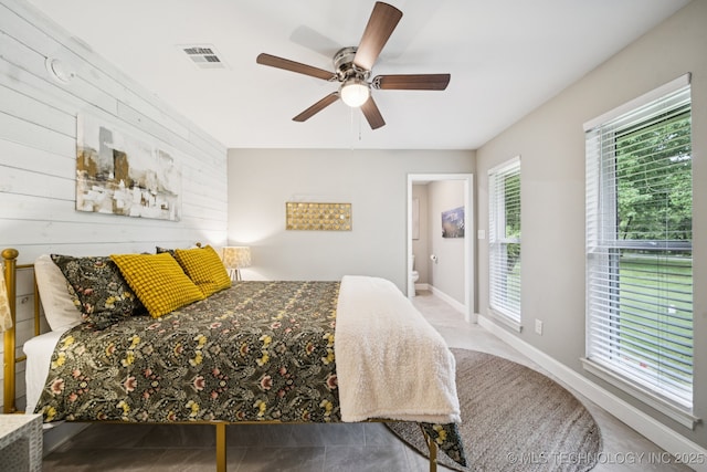 7705 S 232nd E Ave, Broken Arrow, OK 74014 - bedroom with wood walls and a ceiling fan