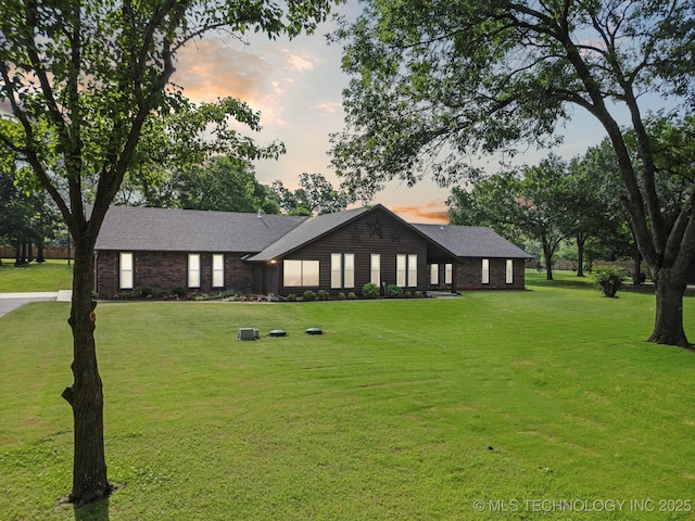 7705 S 232nd E Ave, Broken Arrow, OK 74014 - ranch-style house featuring a lawn and a shingled roof