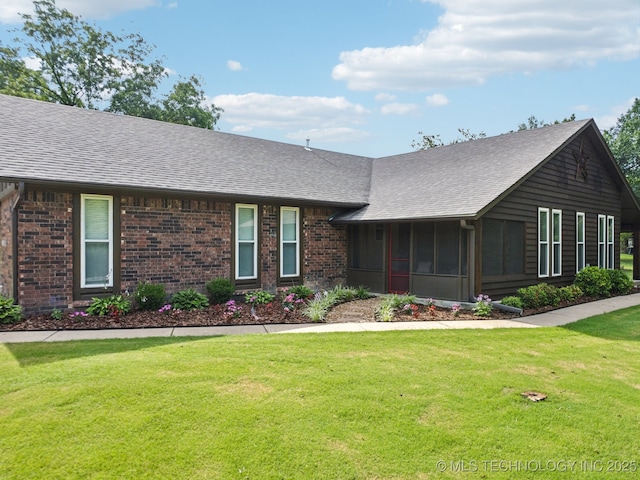 7705 S 232nd E Ave, Broken Arrow, OK 74014 - view of front of house with a shingled roof, a sunroom, brick siding, and a front yard