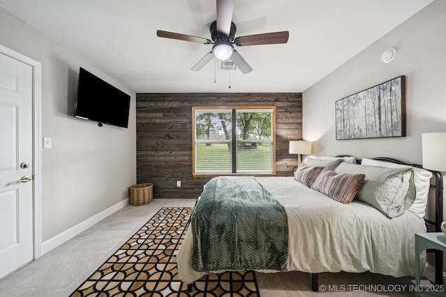 7705 S 232nd E Ave, Broken Arrow, OK 74014 - bedroom featuring wooden walls and ceiling fan