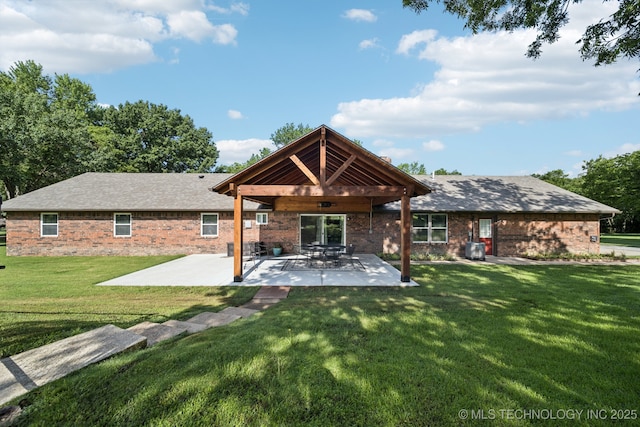 7705 S 232nd E Ave, Broken Arrow, OK 74014 - back of house featuring a patio area, a yard, and brick siding