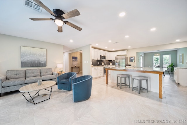 7705 S 232nd E Ave, Broken Arrow, OK 74014 - living room with recessed lighting and ceiling fan