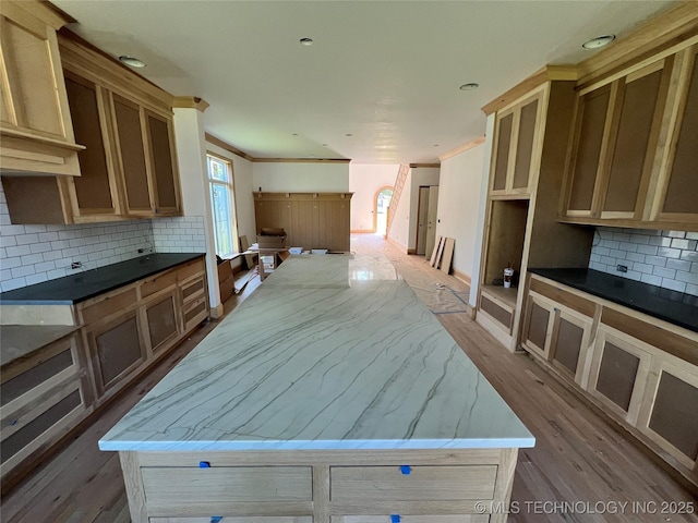 4954 S Boston Pl, Tulsa, OK 74105 - kitchen with tasteful backsplash, wood finished floors, a kitchen island, and crown molding