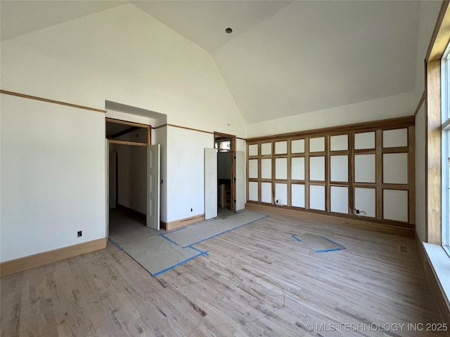 4954 S Boston Pl, Tulsa, OK 74105 - unfurnished bedroom featuring high vaulted ceiling and wood finished floors