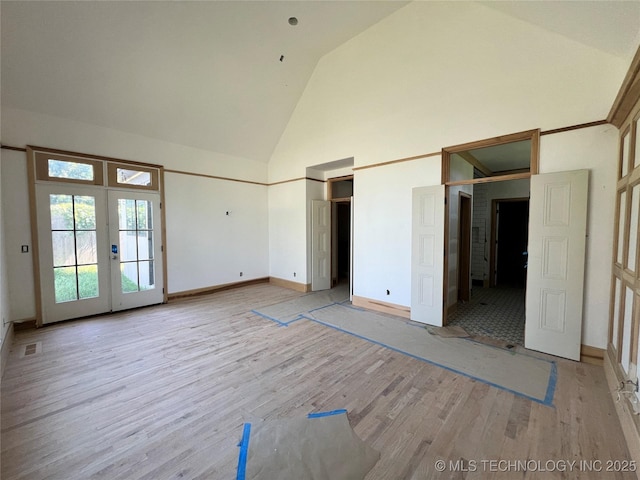 4954 S Boston Pl, Tulsa, OK 74105 - unfurnished bedroom with french doors, high vaulted ceiling, light wood-style floors, and access to exterior
