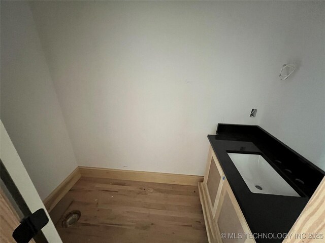 4954 S Boston Pl, Tulsa, OK 74105 - bathroom with wood finished floors and vanity