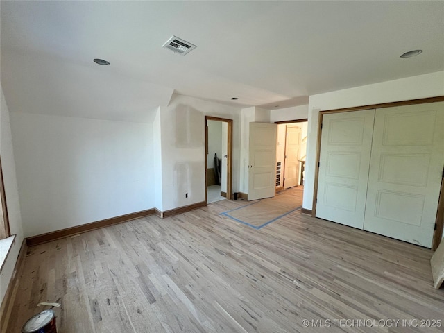 4954 S Boston Pl, Tulsa, OK 74105 - unfurnished bedroom with light wood finished floors and a closet