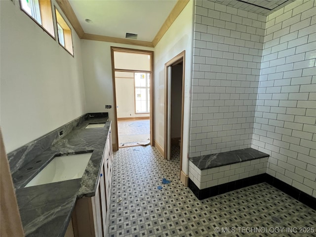 4954 S Boston Pl, Tulsa, OK 74105 - full bath with double vanity, tile patterned floors, healthy amount of natural light, and tiled shower