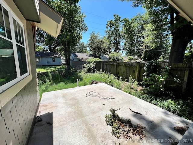 4954 S Boston Pl, Tulsa, OK 74105 - fenced backyard with a patio area