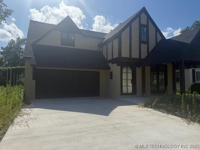 4954 S Boston Pl, Tulsa, OK 74105 - view of front of home with french doors, driveway, and stucco siding