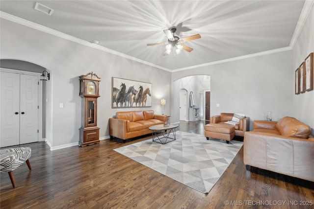 1819 E 43rd St, Sand Springs, OK 74063 - living area with arched walkways, wood finished floors, a ceiling fan, and ornamental molding