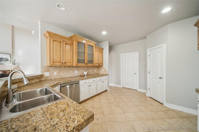 12916 E 181st St S, Bixby, OK 74008 - kitchen with stainless steel dishwasher, backsplash, glass insert cabinets, recessed lighting, and light tile patterned floors