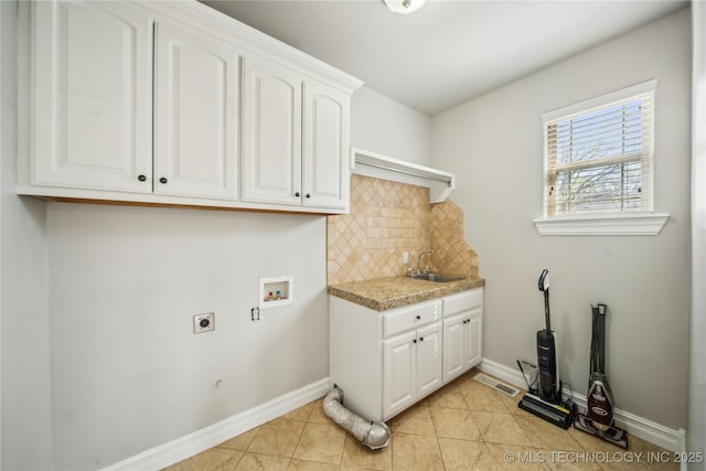 12916 E 181st St S, Bixby, OK 74008 - laundry area featuring hookup for an electric dryer, cabinet space, bar with sink, hookup for a washing machine, and light tile patterned floors