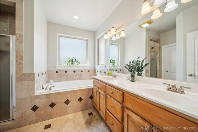 12916 E 181st St S, Bixby, OK 74008 - bathroom with double vanity, a stall shower, a bath, and tile patterned flooring