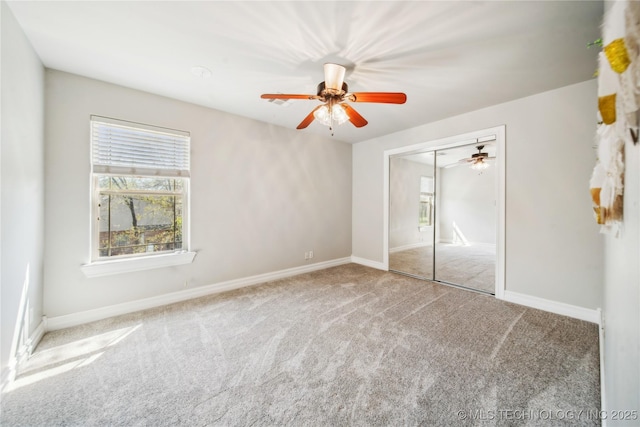 12916 E 181st St S, Bixby, OK 74008 - unfurnished bedroom with multiple windows, carpet flooring, a closet, and ceiling fan