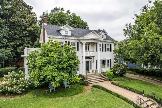1006 E 17th Pl, Tulsa, OK 74120 - greek revival house with a front lawn, a balcony, a chimney, and roof with shingles