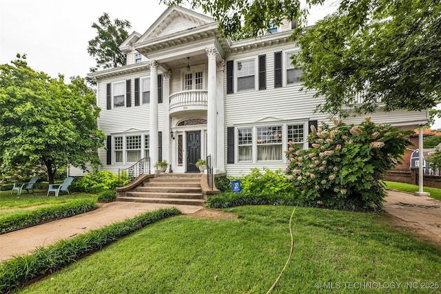 1006 E 17th Pl, Tulsa, OK 74120 - greek revival inspired property featuring a balcony and a front yard