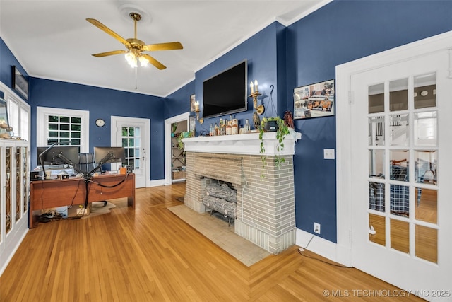 1006 E 17th Pl, Tulsa, OK 74120 - office space with a ceiling fan, french doors, a brick fireplace, and wood finished floors
