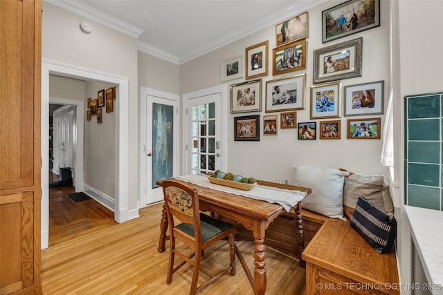 1006 E 17th Pl, Tulsa, OK 74120 - dining room featuring light wood-style flooring and crown molding