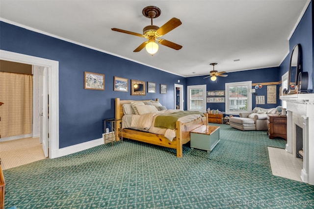 1006 E 17th Pl, Tulsa, OK 74120 - carpeted bedroom with a fireplace with flush hearth, crown molding, and ceiling fan