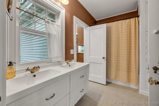 1006 E 17th Pl, Tulsa, OK 74120 - bathroom featuring double vanity and a shower with shower curtain