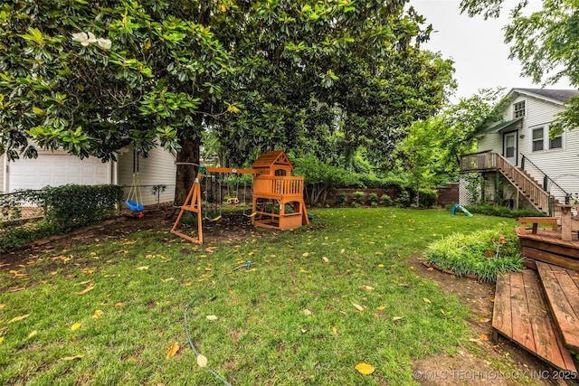 1006 E 17th Pl, Tulsa, OK 74120 - view of yard with a playground, a deck, stairway, and a garage