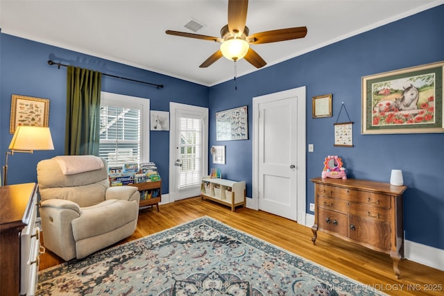1006 E 17th Pl, Tulsa, OK 74120 - living area with ceiling fan and wood finished floors