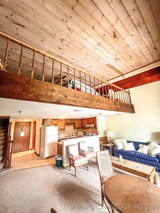 56701 E 310th Rd Unit 712, Afton, OK 74331 - living room featuring light carpet, beam ceiling, and a high ceiling