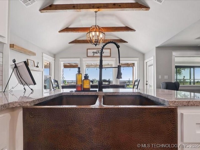 4270 S 4110th Rd, Talala, OK 74080 - kitchen with a chandelier and stone counters