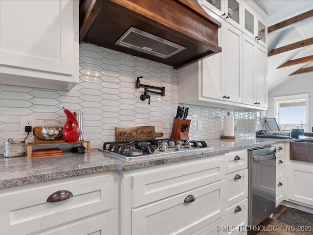 4270 S 4110th Rd, Talala, OK 74080 - kitchen with custom exhaust hood, appliances with stainless steel finishes, decorative backsplash, white cabinets, and glass insert cabinets