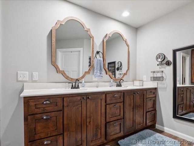 4270 S 4110th Rd, Talala, OK 74080 - bathroom featuring double vanity and wood finished floors