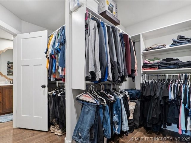 4270 S 4110th Rd, Talala, OK 74080 - walk in closet featuring wood finished floors