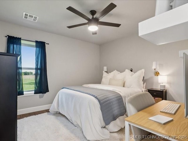 4270 S 4110th Rd, Talala, OK 74080 - bedroom featuring wood finished floors and a ceiling fan