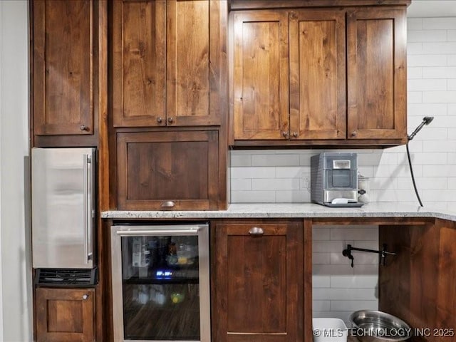 4270 S 4110th Rd, Talala, OK 74080 - bar featuring beverage cooler and tasteful backsplash