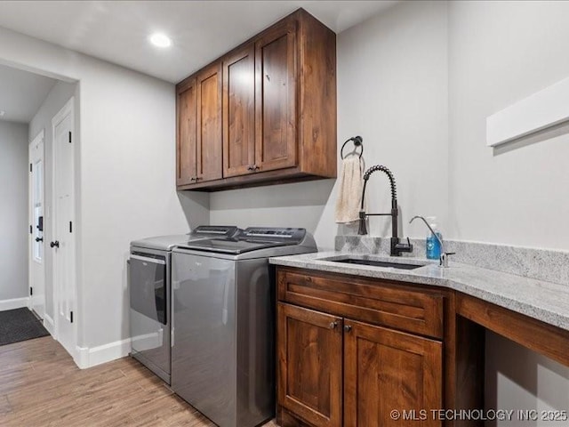 4270 S 4110th Rd, Talala, OK 74080 - laundry area featuring washer and dryer, cabinet space, light wood-style floors, and recessed lighting