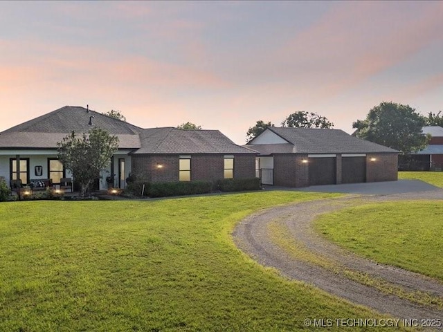 4270 S 4110th Rd, Talala, OK 74080 - view of front of house with driveway, a lawn, and an attached garage