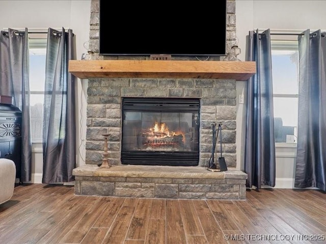4270 S 4110th Rd, Talala, OK 74080 - detailed view of wood finished floors and a fireplace