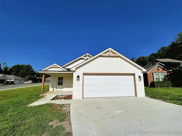 2005 N Alora Ave, Tahlequah, OK 74464 - view of front of property with brick siding, an attached garage, a front yard, and driveway