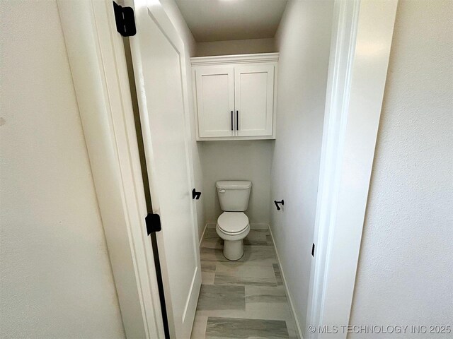 2005 N Alora Ave, Tahlequah, OK 74464 - bathroom featuring baseboards and marble finish floors
