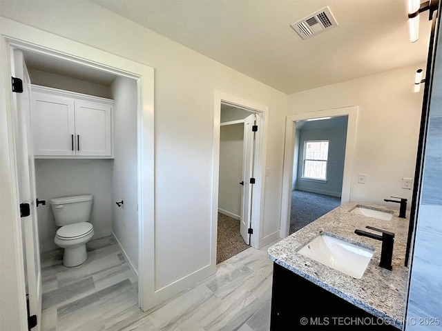 2005 N Alora Ave, Tahlequah, OK 74464 - full bathroom featuring double vanity and wood finished floors